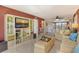 Spacious living room with a large TV, built-in shelving, and comfortable seating, perfect for entertaining at 5855 Midnight Pass Rd # 303, Sarasota, FL 34242