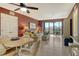 Cozy living room with a dining area and balcony access at 5855 Midnight Pass Rd # 303, Sarasota, FL 34242