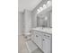 Well-lit bathroom with a white vanity, framed mirror, and modern decor at 6027 White Mangrove Ln, Bradenton, FL 34210