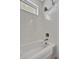 Modern bathroom featuring a shower-tub combination and natural light at 6027 White Mangrove Ln, Bradenton, FL 34210