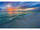 Picturesque sunset over a serene beach with gentle waves, creating a peaceful and inviting atmosphere at 6027 White Mangrove Ln, Bradenton, FL 34210