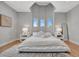Serene bedroom with unique ceiling design, offering a relaxing retreat at 6027 White Mangrove Ln, Bradenton, FL 34210