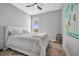 Cozy bedroom featuring a ceiling fan, carpeted floors, and soft decor at 6027 White Mangrove Ln, Bradenton, FL 34210