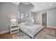 Bright bedroom with large windows, light hardwood floors, and modern decor at 6027 White Mangrove Ln, Bradenton, FL 34210
