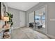 Entryway with tile flooring, sliding glass doors to backyard, modern console table, and neutral paint at 6027 White Mangrove Ln, Bradenton, FL 34210