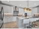 Bright kitchen boasts modern stainless steel appliances, sleek countertops, and a kitchen island with bar seating at 6027 White Mangrove Ln, Bradenton, FL 34210
