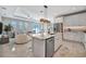 Bright, open kitchen boasts a large island, stainless steel appliances, and seamless flow into the living area at 6027 White Mangrove Ln, Bradenton, FL 34210