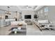 Open-concept living room showcases stylish decor, modern furnishings, and abundant natural light at 6027 White Mangrove Ln, Bradenton, FL 34210