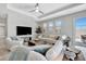 Comfortable living room with modern décor, large windows, and stylish furnishings at 6027 White Mangrove Ln, Bradenton, FL 34210