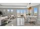Bright open-concept living and dining area, showcasing modern decor and access to the outdoor patio at 6027 White Mangrove Ln, Bradenton, FL 34210