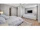 Spacious main bedroom with a comfortable sitting area and a large television at 6027 White Mangrove Ln, Bradenton, FL 34210