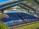 View of sheltered pickleball courts, showing multiple matches in progress and the recreational atmosphere of the facility at 6027 White Mangrove Ln, Bradenton, FL 34210