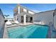 A clear view of the backyard pool and lounge chairs, perfect for relaxing and entertaining at 6027 White Mangrove Ln, Bradenton, FL 34210