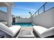 Relaxation awaits by the pool with comfortable loungers and stylish outdoor decor at 6027 White Mangrove Ln, Bradenton, FL 34210