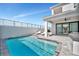 Beautiful pool area with lounge seating, integrated hot tub, and an inviting outdoor living space at 6027 White Mangrove Ln, Bradenton, FL 34210