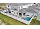 Rear exterior elevation featuring a private pool, patio, and a covered outdoor lounge area at 6027 White Mangrove Ln, Bradenton, FL 34210