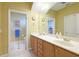 Bright bathroom featuring a double vanity, large mirror, and decorative accents for a luxurious feel at 6103 Aviary Ct, Bradenton, FL 34203