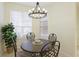 Cozy breakfast nook with a round table, decorative chairs, and natural light from nearby windows at 6103 Aviary Ct, Bradenton, FL 34203