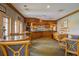 Interior view of clubhouse bar with seating and wood trim and liquor at 6103 Aviary Ct, Bradenton, FL 34203