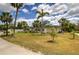 Exterior view of the community clubhouse, showing the landscaping and lawn at 6103 Aviary Ct, Bradenton, FL 34203
