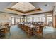 Spacious dining room with elegant tables and chairs, perfect for large gatherings and events at 6103 Aviary Ct, Bradenton, FL 34203