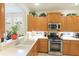 Well-equipped kitchen features stainless steel appliances, ample cabinets, and a cozy breakfast nook at 6103 Aviary Ct, Bradenton, FL 34203