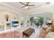 Spacious living room filled with natural light, showcasing a comfortable seating area and tiled flooring at 6103 Aviary Ct, Bradenton, FL 34203