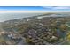 Aerial view showcasing the community and this home's proximity to the bay at 612 Weston Pointe Ct, Longboat Key, FL 34228