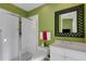 Light bathroom with a glass-enclosed shower and a large mirror above the vanity at 612 Weston Pointe Ct, Longboat Key, FL 34228
