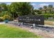 Elegant Bay Isles Beach Club sign surrounded by lush landscaping at 612 Weston Pointe Ct, Longboat Key, FL 34228