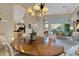 Dining area with view of outdoor entertaining and pool area at 612 Weston Pointe Ct, Longboat Key, FL 34228