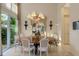 Formal dining room with chandelier and large window at 612 Weston Pointe Ct, Longboat Key, FL 34228