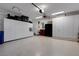 A spacious garage features ample storage cabinets and a clean, epoxy-coated floor at 612 Weston Pointe Ct, Longboat Key, FL 34228