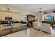 Bright kitchen with black granite countertops, light cabinets, and open floorplan at 612 Weston Pointe Ct, Longboat Key, FL 34228
