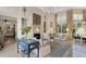 Bright living room boasts fireplace, large windows, and elegant furnishings at 612 Weston Pointe Ct, Longboat Key, FL 34228