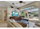 Cozy living room showcasing sliding doors to the patio and pool area at 612 Weston Pointe Ct, Longboat Key, FL 34228