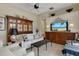 Comfortable living room featuring built-in display cabinets and contemporary decor at 612 Weston Pointe Ct, Longboat Key, FL 34228