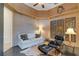 A well-appointed living room features a comfy sofa, modern chair with ottoman, and unique wall art at 612 Weston Pointe Ct, Longboat Key, FL 34228