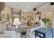 Elegant living room with chandelier, sitting area, and large windows with lots of light at 612 Weston Pointe Ct, Longboat Key, FL 34228