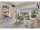 Bright living room with sliding glass doors and luxury decor at 612 Weston Pointe Ct, Longboat Key, FL 34228