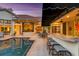 Inviting backyard pool area with outdoor kitchen and patio furniture at 612 Weston Pointe Ct, Longboat Key, FL 34228
