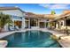 Inviting backyard pool area with patio furniture and outdoor living space at 612 Weston Pointe Ct, Longboat Key, FL 34228