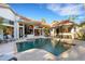 Stunning backyard with pool, patio and outdoor kitchen, perfect for entertaining guests at 612 Weston Pointe Ct, Longboat Key, FL 34228