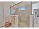 Luxurious glass shower with multiple shower heads and a convenient bench for relaxation at 6437 Spanish Bayonet Way, Bradenton, FL 34210