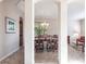 Formal dining room visible through arched doorway with table and chairs at 6642 Cheswick St, Sarasota, FL 34243