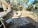 Spacious backyard with a tiled patio, ideal for outdoor seating and enjoying nature at 6924 Tuxedo St, Englewood, FL 34224