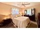 Cozy bedroom featuring plush bedding, neutral colors, and abundant natural light, creating a tranquil and inviting atmosphere at 6924 Tuxedo St, Englewood, FL 34224