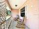 Inviting front porch with rocking chairs offers a relaxing outdoor space to enjoy the fresh air and neighborhood views at 6924 Tuxedo St, Englewood, FL 34224