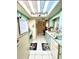 Functional kitchen with retro-mint cabinets, skylight and tile floors at 6924 Tuxedo St, Englewood, FL 34224