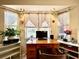 Office/den featuring a vintage aesthetic with tile flooring and wooden desk at 6924 Tuxedo St, Englewood, FL 34224